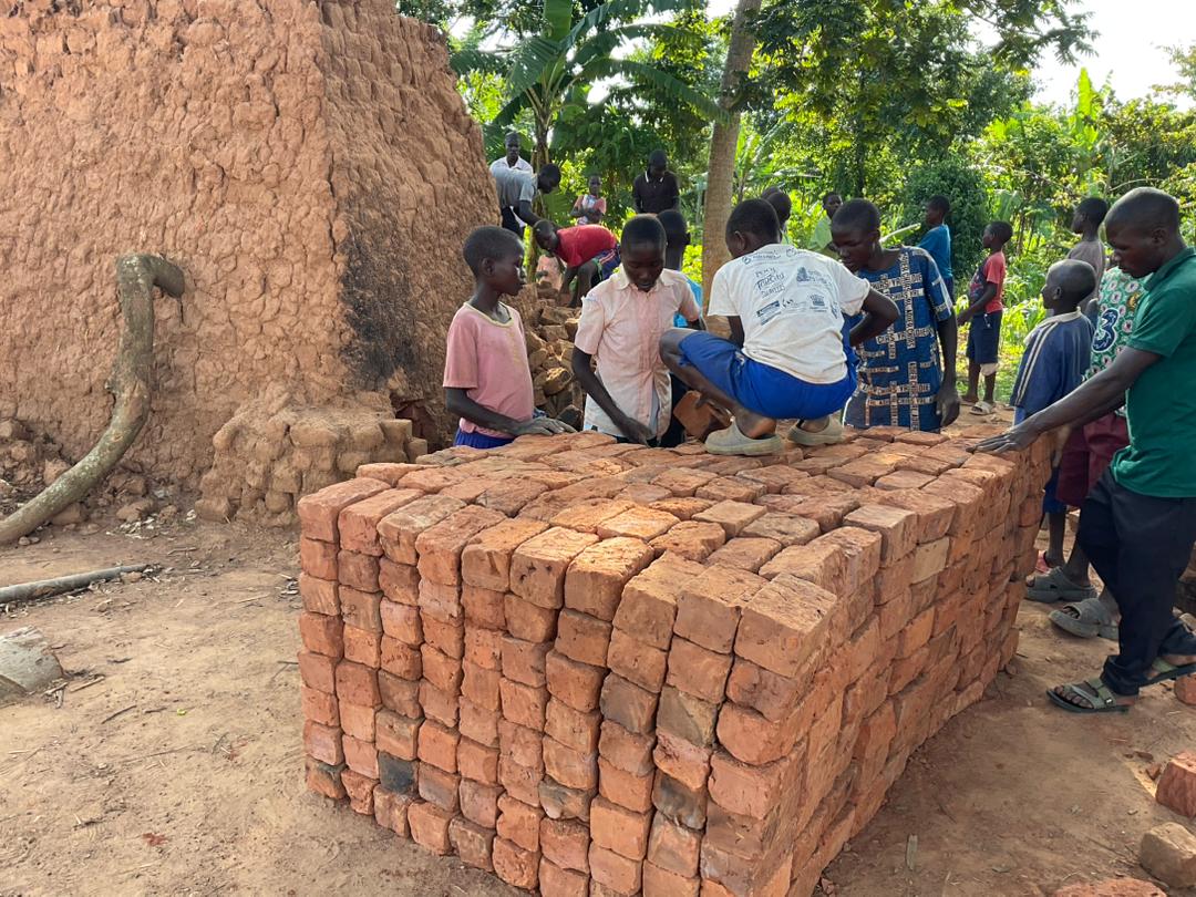 Teachers’ house – helpers building the teachers’ house