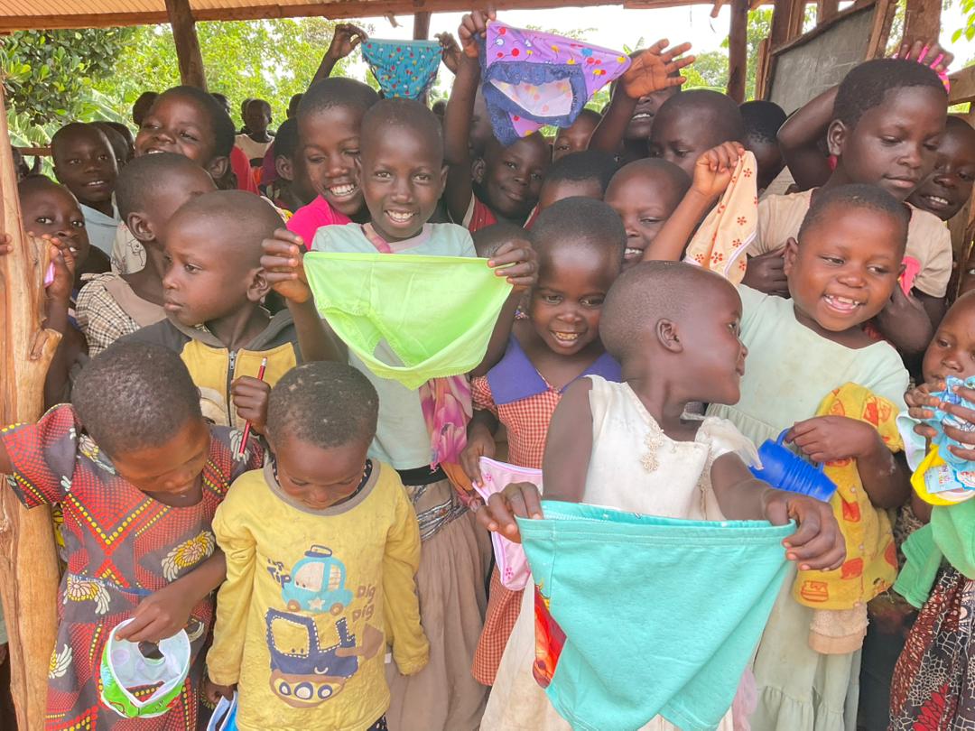 Handing out underwear and clothing to the children